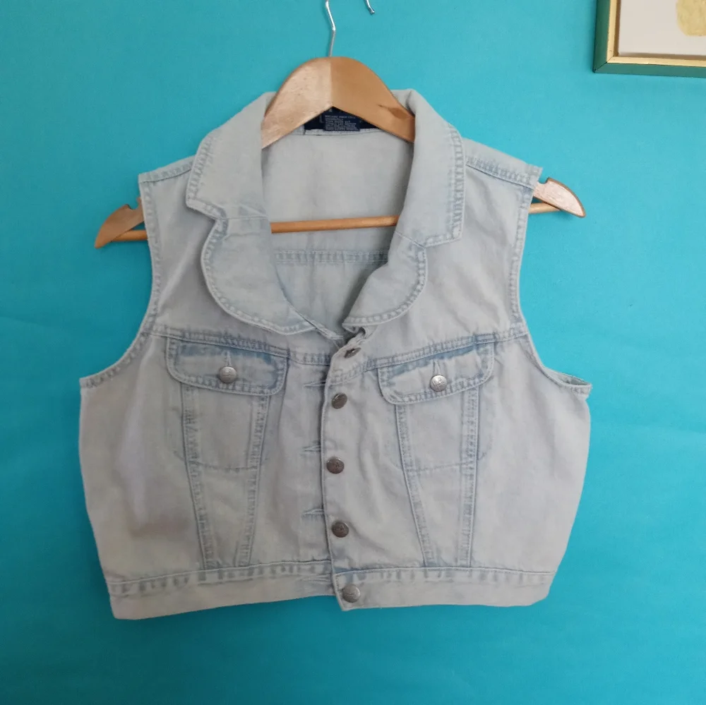 Vest L A . Blue  with a lace heart in the back  size  Large girls color light